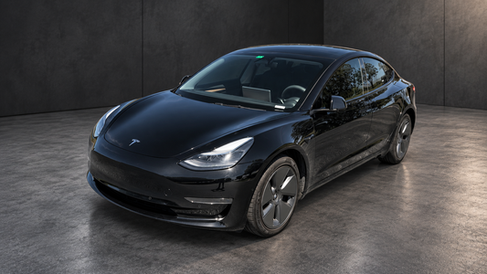 Tesla Model 3 hero view, enhanced from original photo